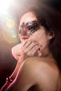 woman with venetian mask, red light Royalty Free Stock Photo