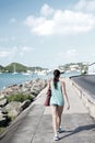 Sexy woman walk along sea in st.thomas, british virgin island. Woman in top and shorts on sea side promenade on sunny Royalty Free Stock Photo