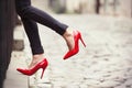 woman wearing red high heel shoes in city Royalty Free Stock Photo