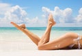 women legs on the beach