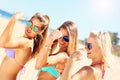 women showing muscles on the beach