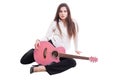 young and beautiful female or woman holding pink guitar Royalty Free Stock Photo