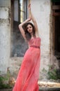 young beauty woman red dress in smoke