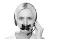 young blond woman in a headset looking at the camera and ca Royalty Free Stock Photo