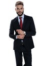Sexy young businessman arranging watch