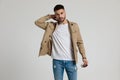 Sexy young casual man in jacket holding hand behind neck Royalty Free Stock Photo