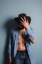 young cowboy with his shirt open Royalty Free Stock Photo