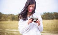 Sexy young girl in knitted with a camera clothes outdoor portrait