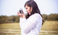 Sexy young girl in knitted with a camera clothes outdoor portrait