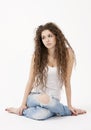 young girl in shirt and torn jeans