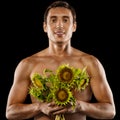 young muscular man with a bouquet of flowers