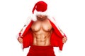 Sexy. Young muscular man wearing Santa hat demonstrate his