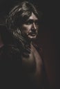 Young Vampire with black coat and long hair, nude Royalty Free Stock Photo