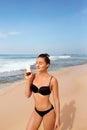 Woman applying sunscreen creme on tanned shoulder. Skincare. Body Sun protection suncream. Royalty Free Stock Photo