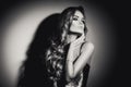 young woman black and white portrait. Seductive young woman with long hair posing Royalty Free Stock Photo