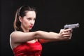 young woman - gun on black background Royalty Free Stock Photo