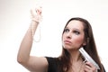 young woman - gun pearl on white Royalty Free Stock Photo