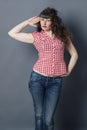 young woman with long hair standing, posing like soldier Royalty Free Stock Photo