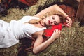 young woman lying on the straw