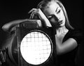 young woman with old floodlight Royalty Free Stock Photo