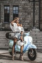 Sexy young woman riding on motorbike in street, summer vacation style, traveling, smiling, happy, having fun, stylish outfit, Royalty Free Stock Photo