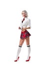 sexy young woman in short schoolgirl plaid skirt and knee socks with eyeglasses posing