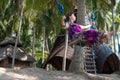 young woman sitting on the swing on the tropical beach, paradise island Bali, Indonesia. Sunny day, happy vacation Royalty Free Stock Photo