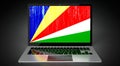 Seychelles - country flag and binary code on laptop screen