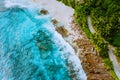 Seychelles Mahe island aerial drone landscape of coastline paradise sandy beach with palm trees and beautiful clear blue Royalty Free Stock Photo