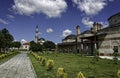 Historical Buildings in a green landscape with blue sky and fluffy clouds