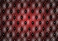 Dark red leather capitone background texture. Red glossy upholstery premium dark fabric texture. Retro Chesterfield style soft Royalty Free Stock Photo