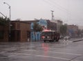SFFD Fire Truck races down fourth street in rain Royalty Free Stock Photo