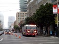 SFFD Red Firetruck drives down street in the rain