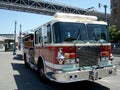 SFFD Red Firetruck parked on street with sun reflecting in the window