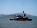 SFPD Fire Boat pass in front of Alcatraz and Angel Island in San Francisco Bay Royalty Free Stock Photo