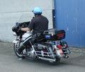 SFPD police officer riding motorcycle at patrol in San Francisco Bay area