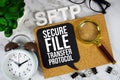 SFTP - Secure File Transfer Protocol acronym with alarm clock and magnifying glass, Data management concept background
