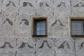 Sgraffito on facade with windows in Slavonice town