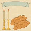 Shabbat candles, kiddush cup and challah.