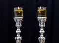 Shabbat candles. Silver candlesticks with olive oil