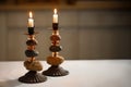 Shabbat candlesticks with burning candles on the kitchen table. Traditional Jewish Shabbat ritual.