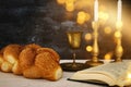 shabbat image. challah bread, shabbat wine and candles on the table