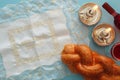 shabbat image. challah bread, wine and candles. Top view