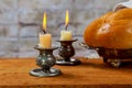 Shabbat with lighted candles, challah bread and wine. Royalty Free Stock Photo