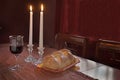 Shabbat Observance At Sunset: Challah, Glass of Wine, Two Lit Candles Royalty Free Stock Photo