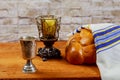 Shabbat or Sabbath kiddush ceremony composition with red kosher wine