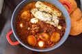 Shabbat or Sabbath traditional food on the hot plate in the kitchen.