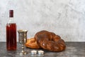 Shabbat Shalom - challah bread, shabbat wine and candles on grey background. With copy space Royalty Free Stock Photo