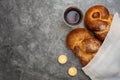 Shabbat Shalom - challah bread, shabbat wine and candles on grey background. Top view. With copy space Royalty Free Stock Photo