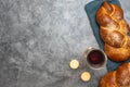 Shabbat Shalom - challah bread, shabbat wine and candles on grey background. Top view. With copy space Royalty Free Stock Photo